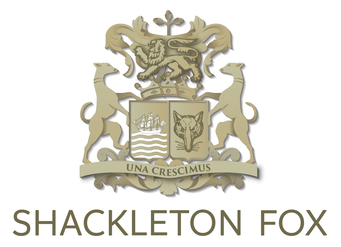 This is the logo of Antiques Dealer "Shackleton Fox". It shows two greyhounds flanking a Lion, with a shield of a ship and a Fox. Has the text "Una Crescimus" which means "Together we thrive"