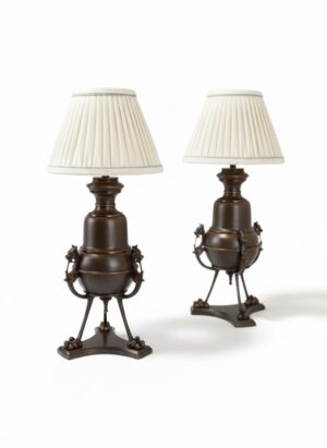 Exceptional pair of c.1880 bronze oil lamps, now converted to table lamps, with sculptural animal-head mounts and paw feet. Fully rewired and PAT inspected.