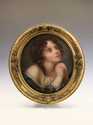 A Mid-19th Century English School Oval Portrait of a Young Woman